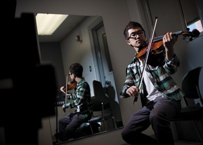<strong>BRANDON WONG |</strong> Staff Photographer<br>Next year, music major Andy Chen’s private violin lessons will go from free to $450 per quarter.