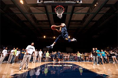 ScottRoederDunk <strong>SCOTT ROEDER |</strong> Staff Photographer<br>Senior Zack Atkinson throws down a windmill dunk during the slam dunk contest at Midnight Magic. Junior Darren Moore ended up winning the contest, beating Atkinson in the finals.