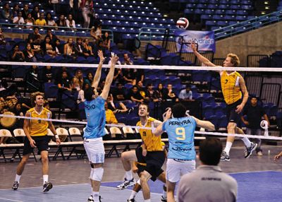 Volleyball <strong>NICHOLAS VU |</strong> Staff Photographer<br>Junior outside hitter Jordan DuFault tips the ball against Drean Bolivar of Argentina.
