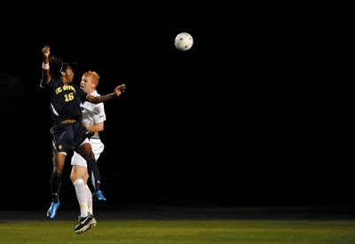 <strong>RASHMI GUTTAL |</strong> Photography Intern<br>UCI junior Amani Walker jumps up to try and head the ball against a rather pesky UCSB defender.