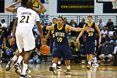 <STRONG>Nick Vu </strong> | Staff Photographer <br>Junior Guard Patrick Rembert pumps up the Anteater defense against Long Beach State University last Saturday. UCI lost the heartbreaking game by a mere two points, 55-53.