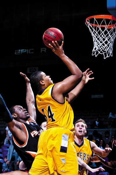 <strong>lee Huang chen | Staff Photographer</strong><br/> Sophomore Eric Wise goes up with one hand while sophomore Adam Folker jostles for position. UCI would fall at home, 61-50, to Pacific.
