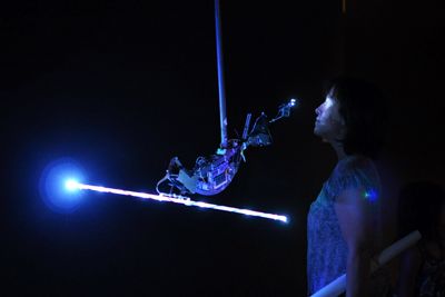 NIKKI JEE | Staff Photographer A gallery visitor marvels at one of the installations at the Beall Center’s exhibition, “Emergence.”