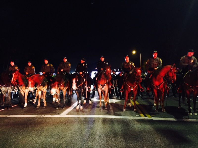 More than 200 Orange County officers, including UCI Police and riot gear-clad officers on horseback, sought to control the scene at Donald Trump's first California rallyThursday night. (Courtesy of Ryan Toves)