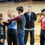 Students learn various self-defense techniques. 