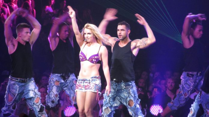 Britney Spears performing with background dancers
