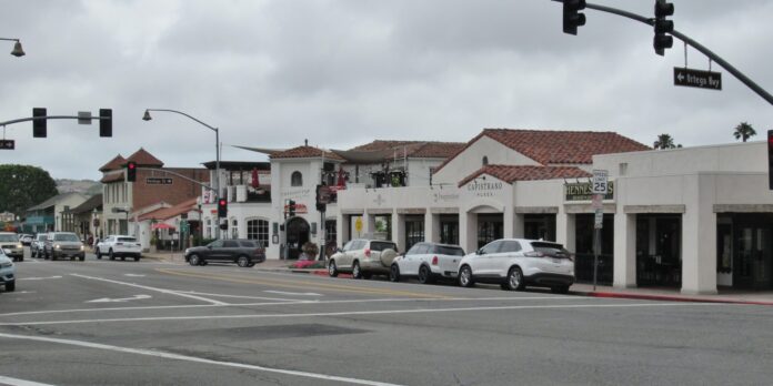 A street-view of Capistrano plaza are shown on a gloomy day.
